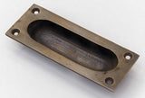 Oval Recessed Sliding Door Pull in Antique Brass